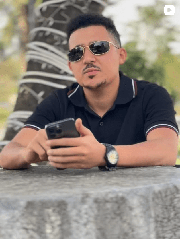 Editorial portrait of a content creator holding a phone